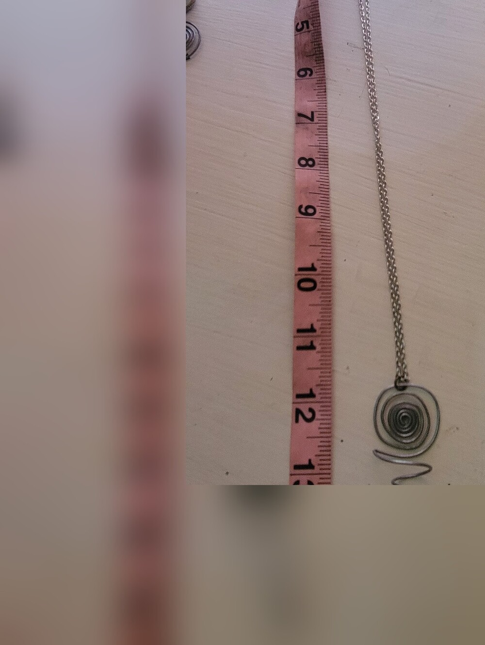 Handmade Spiral Flower Holding Pendant On Silver Chain